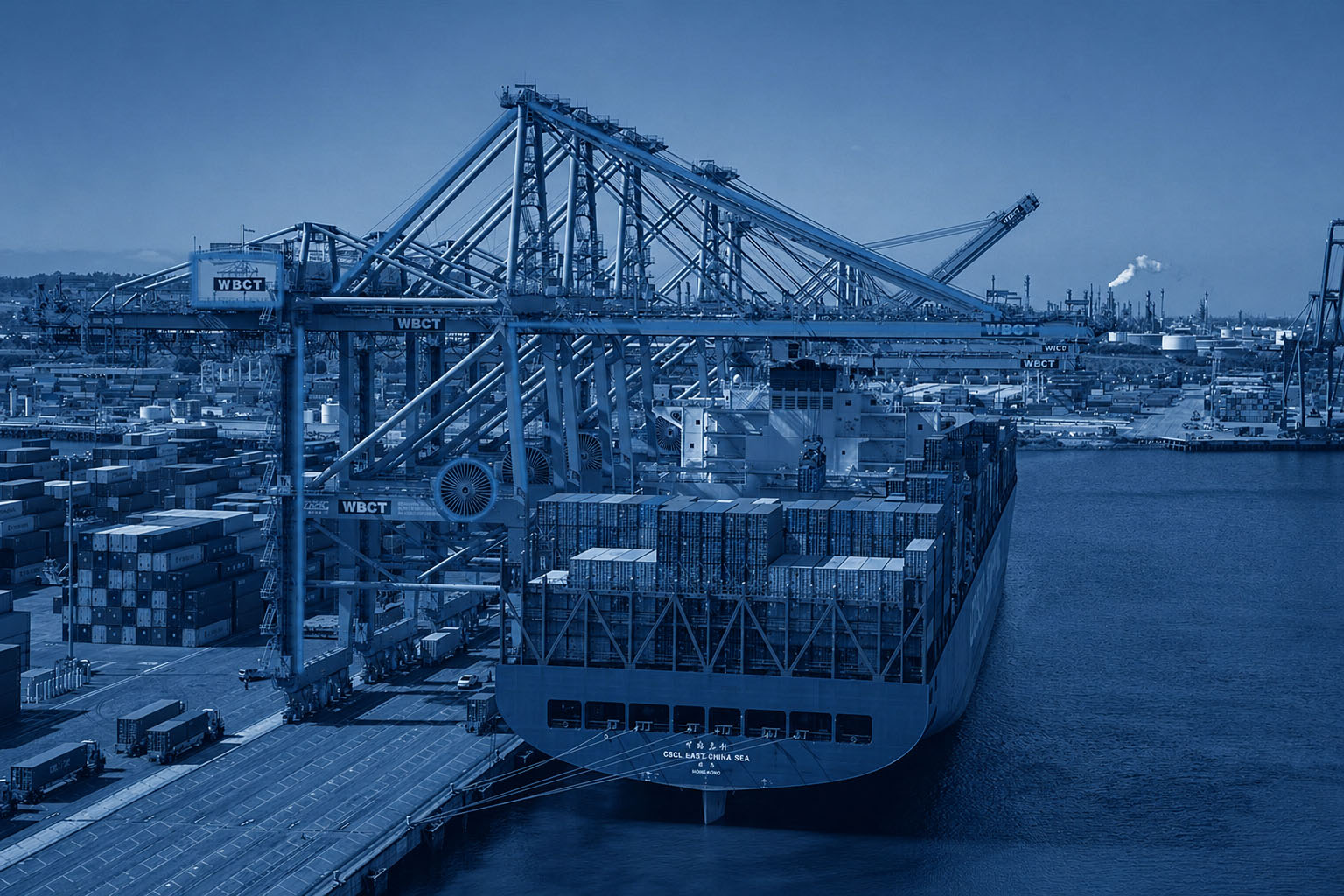 Electrified crane above a docked ship at a port terminal
